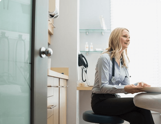 Doctor in clinic looking in front of her