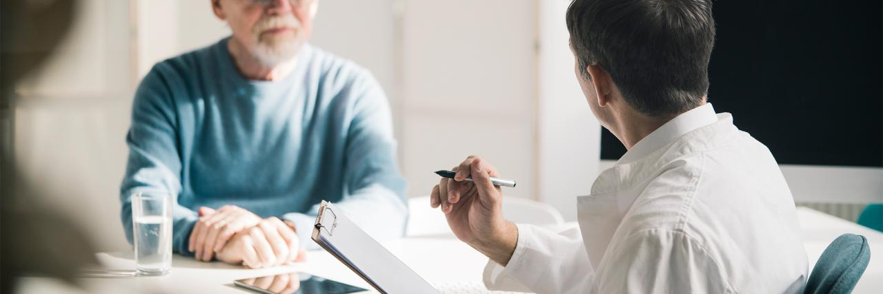 Arzt im Patientengespräch